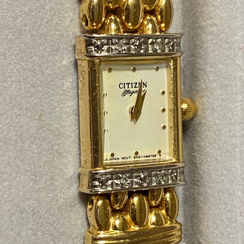 Woman’s Citizen gold watch with diamonds